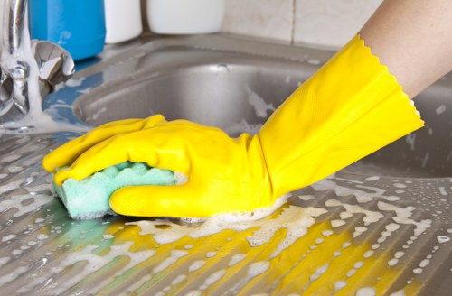 Upholstery cleaning service in E1 removing deep dirt from fabric sofa